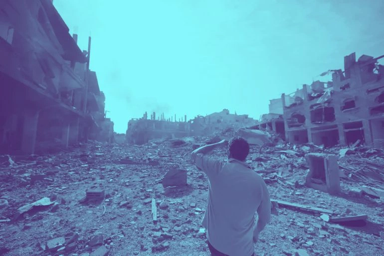 A man on Gaza strip looking at the destruction of the bombing 