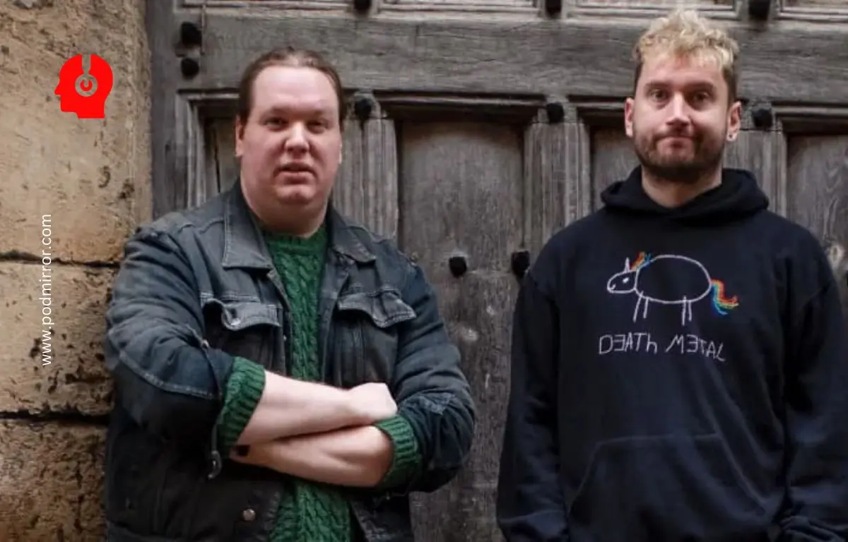 two men standing in front of a door